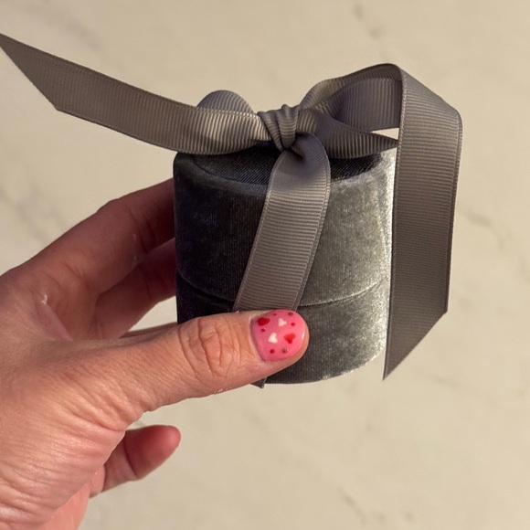 Other - Gray velvet ring box holds one ring